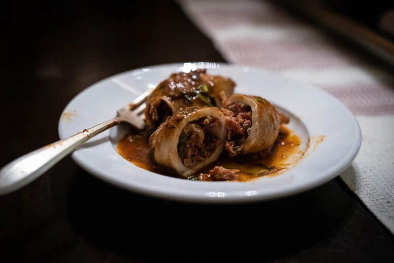 Calamari Stuffed with Chicharrones Prensados in a Guajillo Chile Sauce. - Rancho Gordo